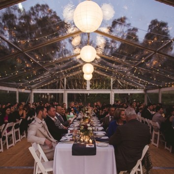 Wedding table under clear marquee